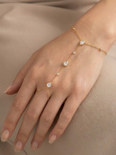 Goudkleurige stainless steel handchain met zirkonia stenen