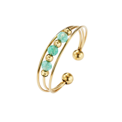 Goudkleurige verstelbare stainless steel ring met groene kralen - speelse damesring