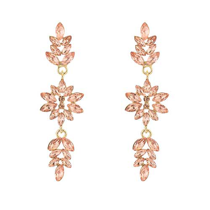Goudkleurige lange statementoorbel van roestvrij staal met roze crystal, ideaal voor feestelijke gelegenheden.